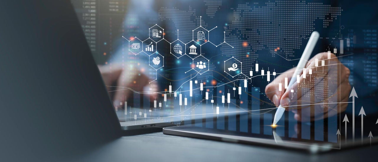 Digital illustration of a person using a laptop and writing on a tablet with charts and financial icons overlaid on the image.