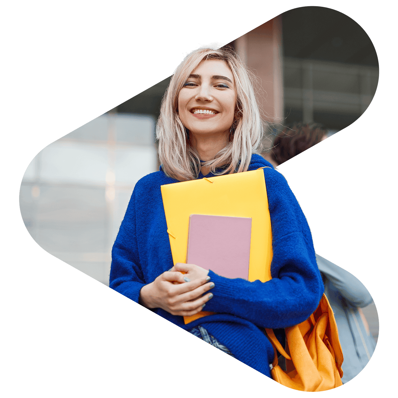 a woman smiling while holding schoolbooks