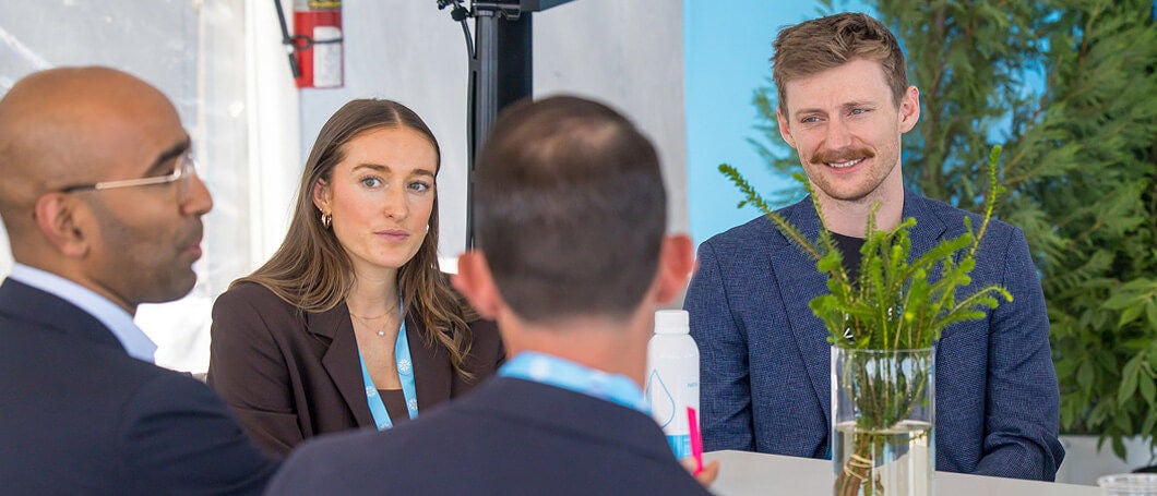 Attendees talking at Snowflake Summit 25