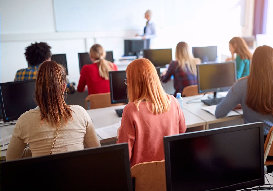 back view of students sitting in a college lecture