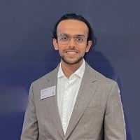 Headshot-style photo of Rishi Dubey