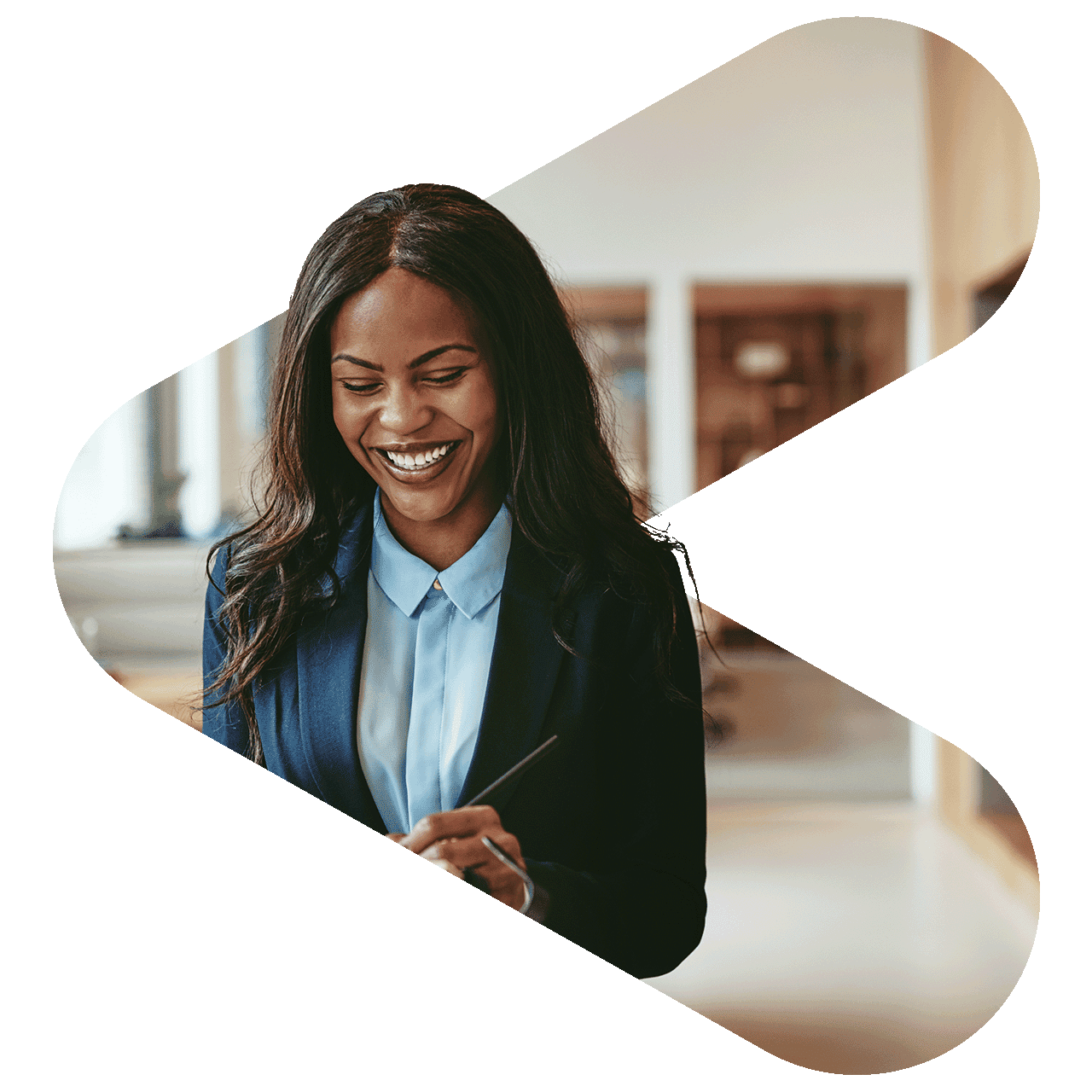 woman wearing suit writing with a pen on a pad of paper