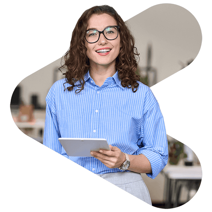 woman smiling while holding a tablet