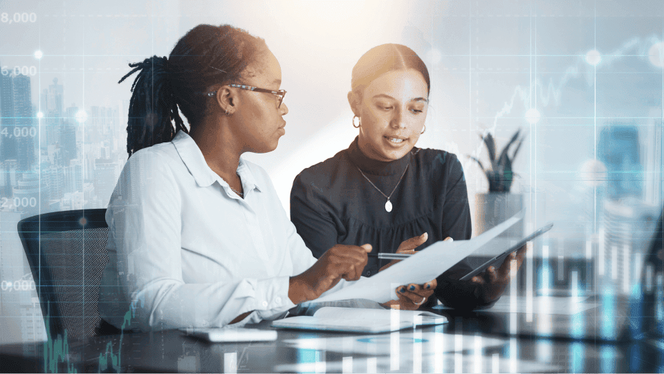 Two coworkers looking at a tablet