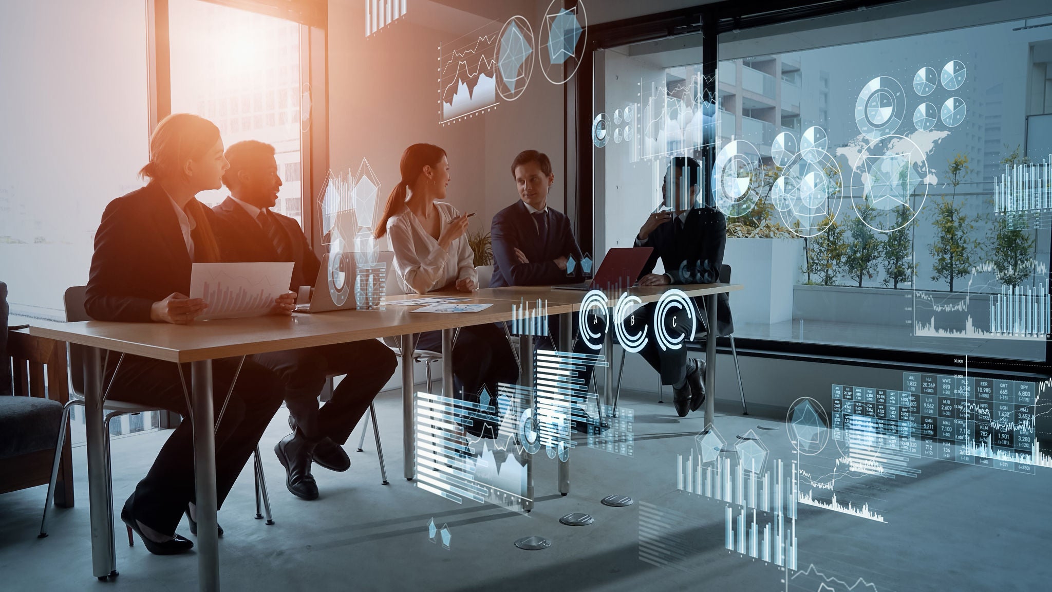 Three people having a meeting in a conference room