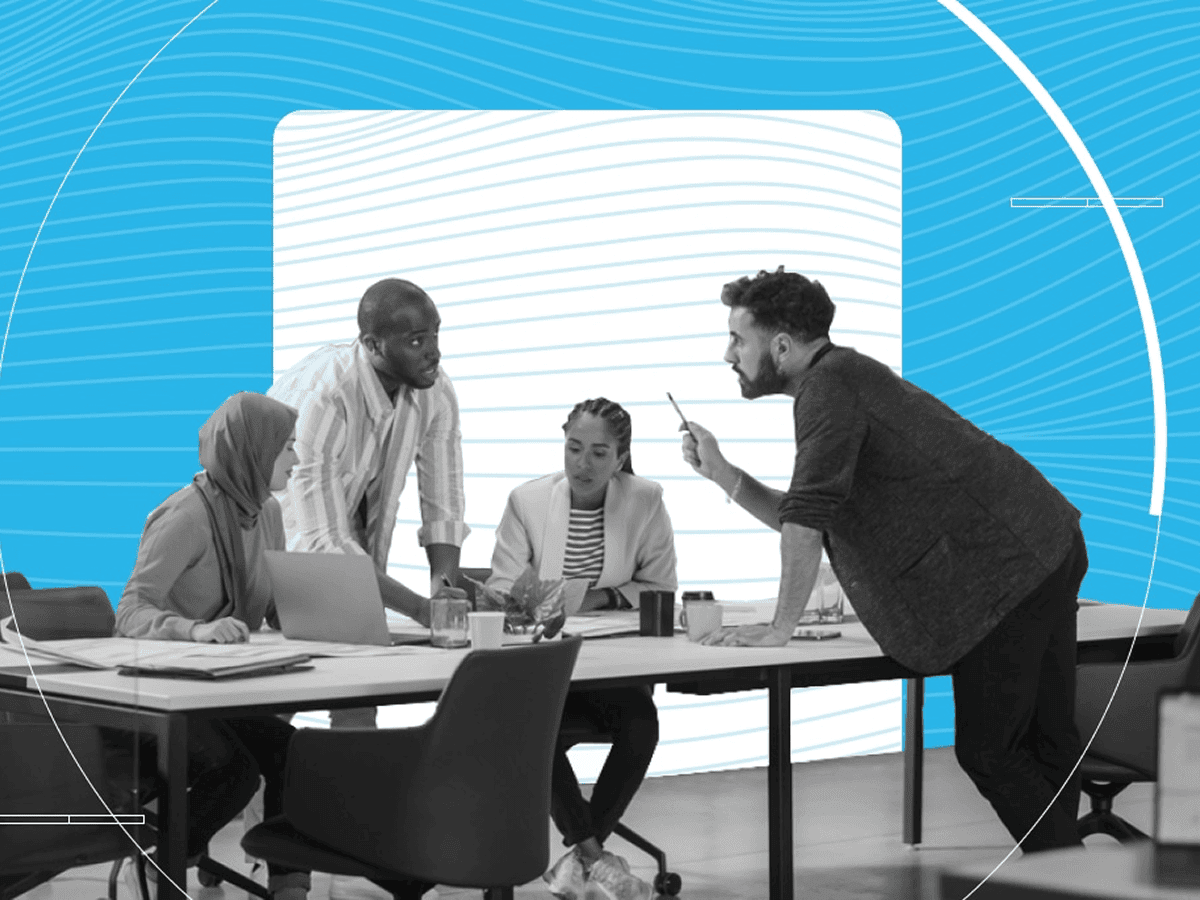 Coworkers collaborating together around a meeting table