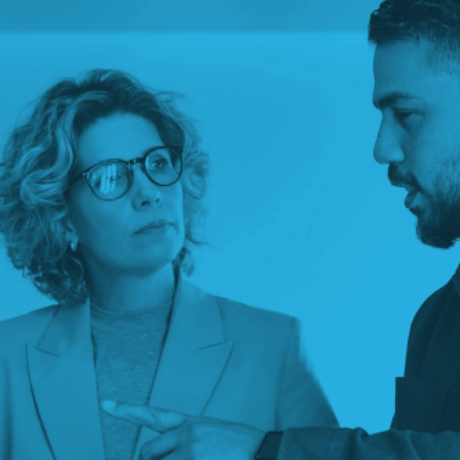 woman and man talking to eachother; blue overlay on image