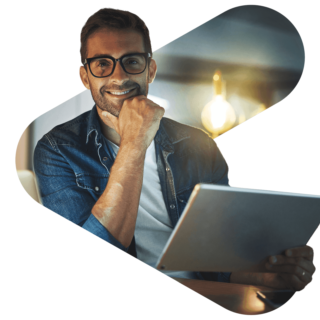 man wearing glasses with his hand on his chin which holding a tablet