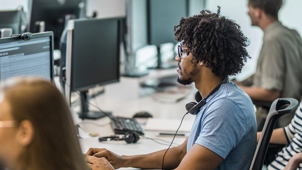 A developer working in an open office setting