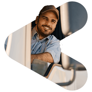 Truck driver smiling while leaning out a window
