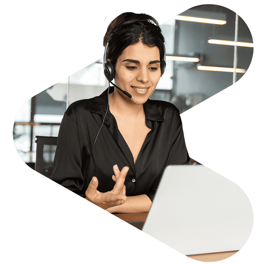 financial services worker smiling while on a call on her laptop