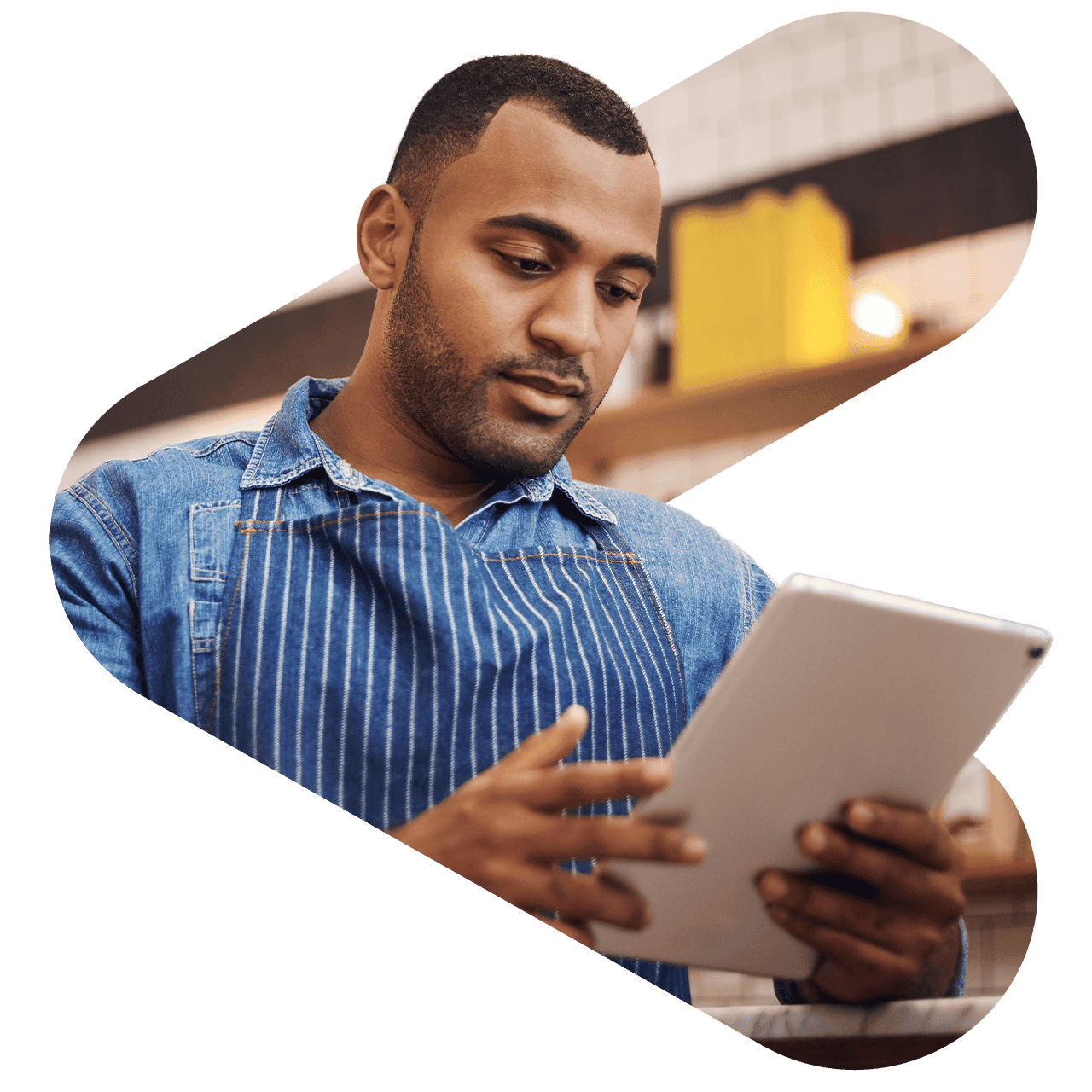 Burger restaurant manager looking at an iPad