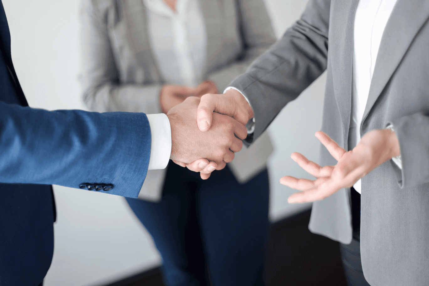 business workers shaking hands