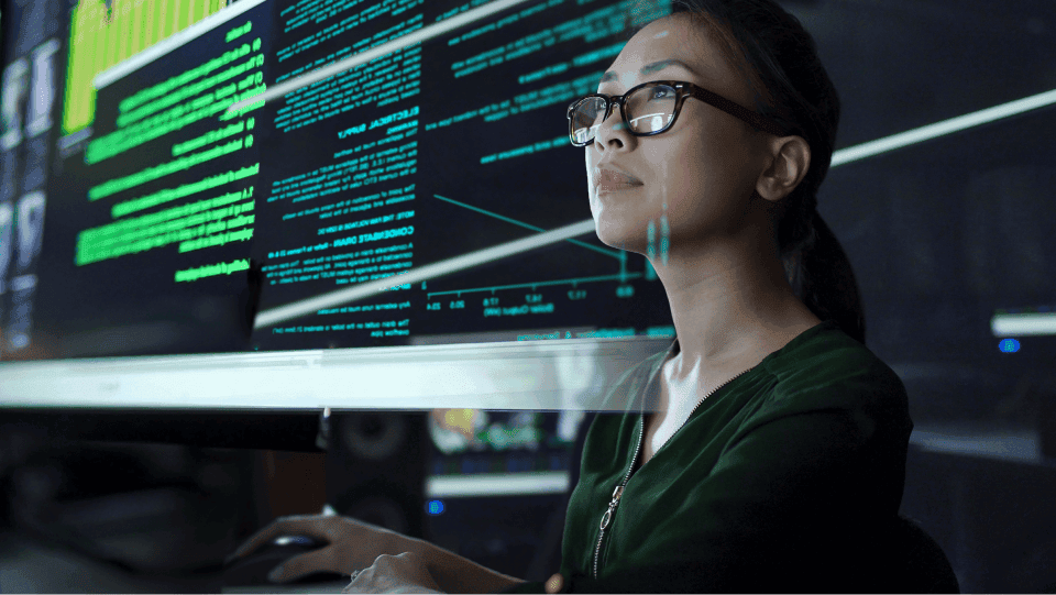 Data engineer sitting in front of a computer