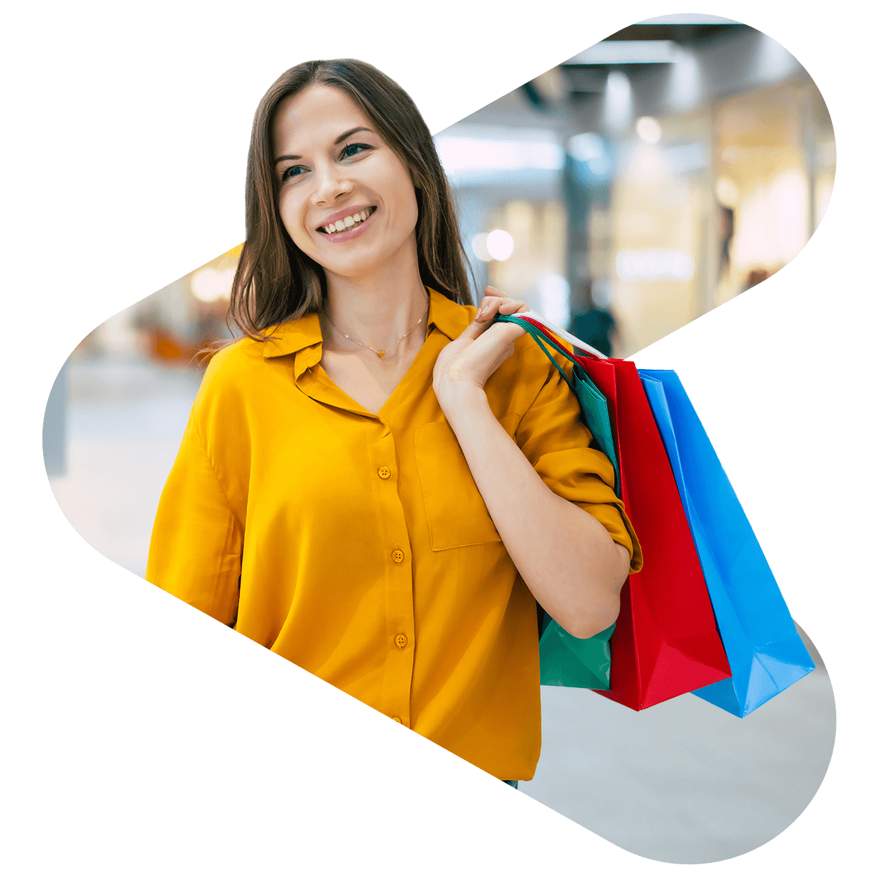 woman wearing yellow shirt holding multiple shopping bags over her shoulder