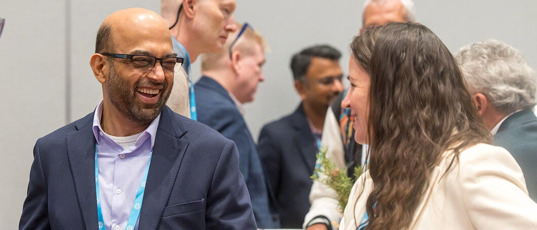 Attendees smiling at Snowflake Summit 25