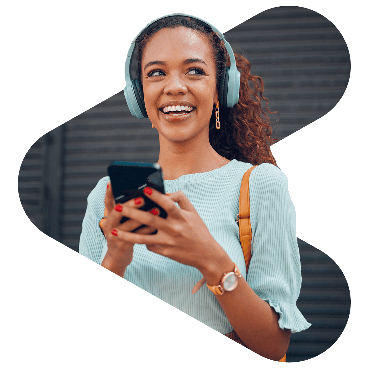 woman wearing headphones using phone