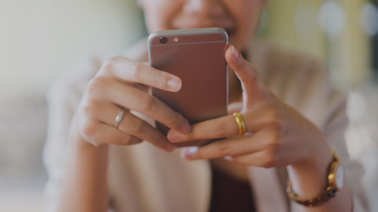 Woman texting on a cell phone