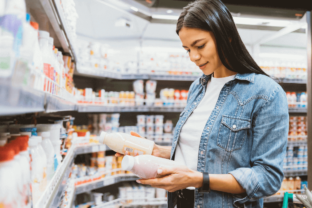 woman shopping for bottled drinks