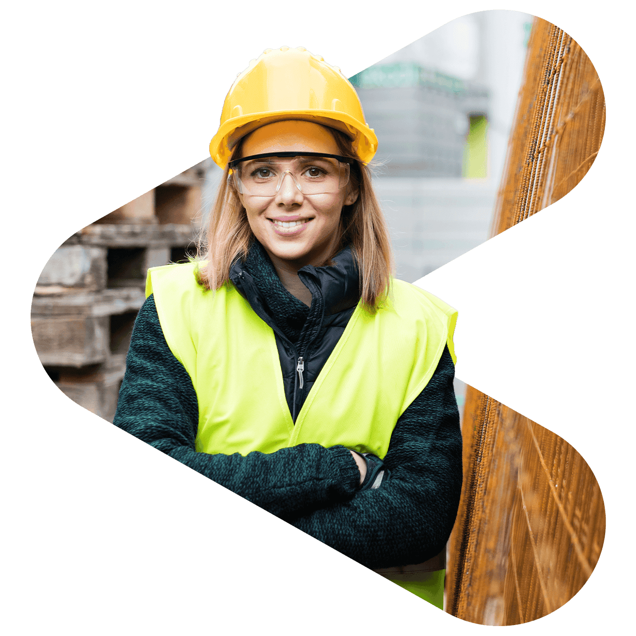 woman wearing a high vis vest and hard hat facing the camera