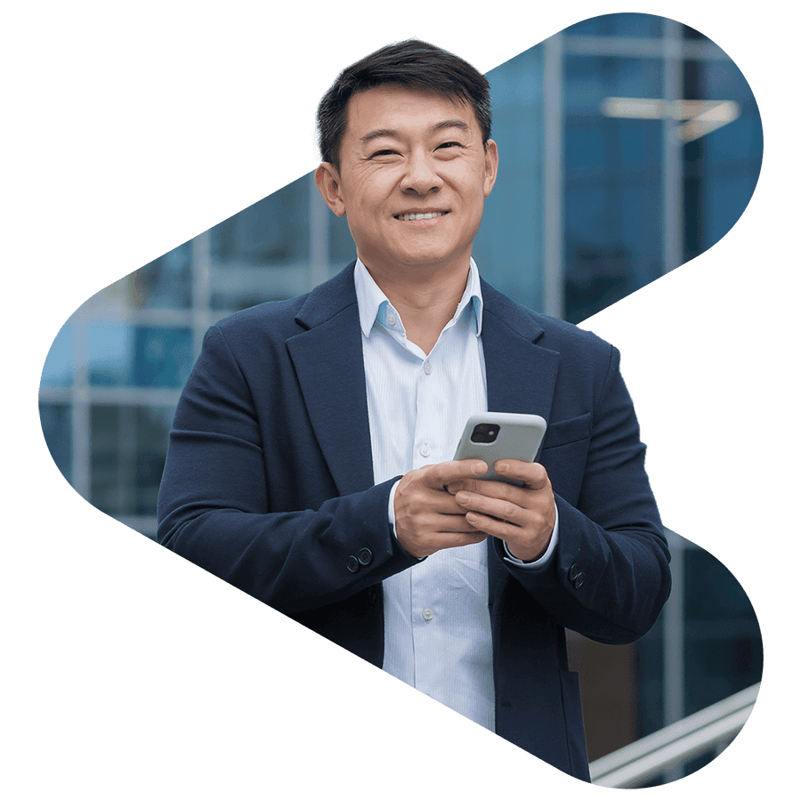 asian man wearing suit and holding phone