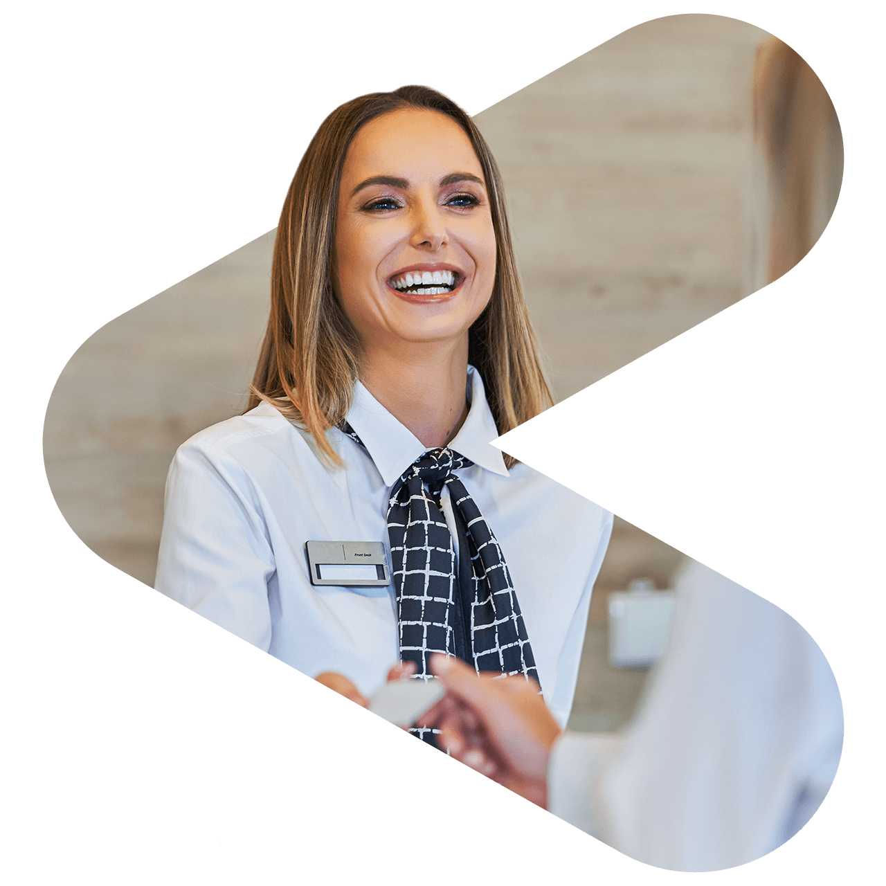 two coworkers both holding and looking at a tablet