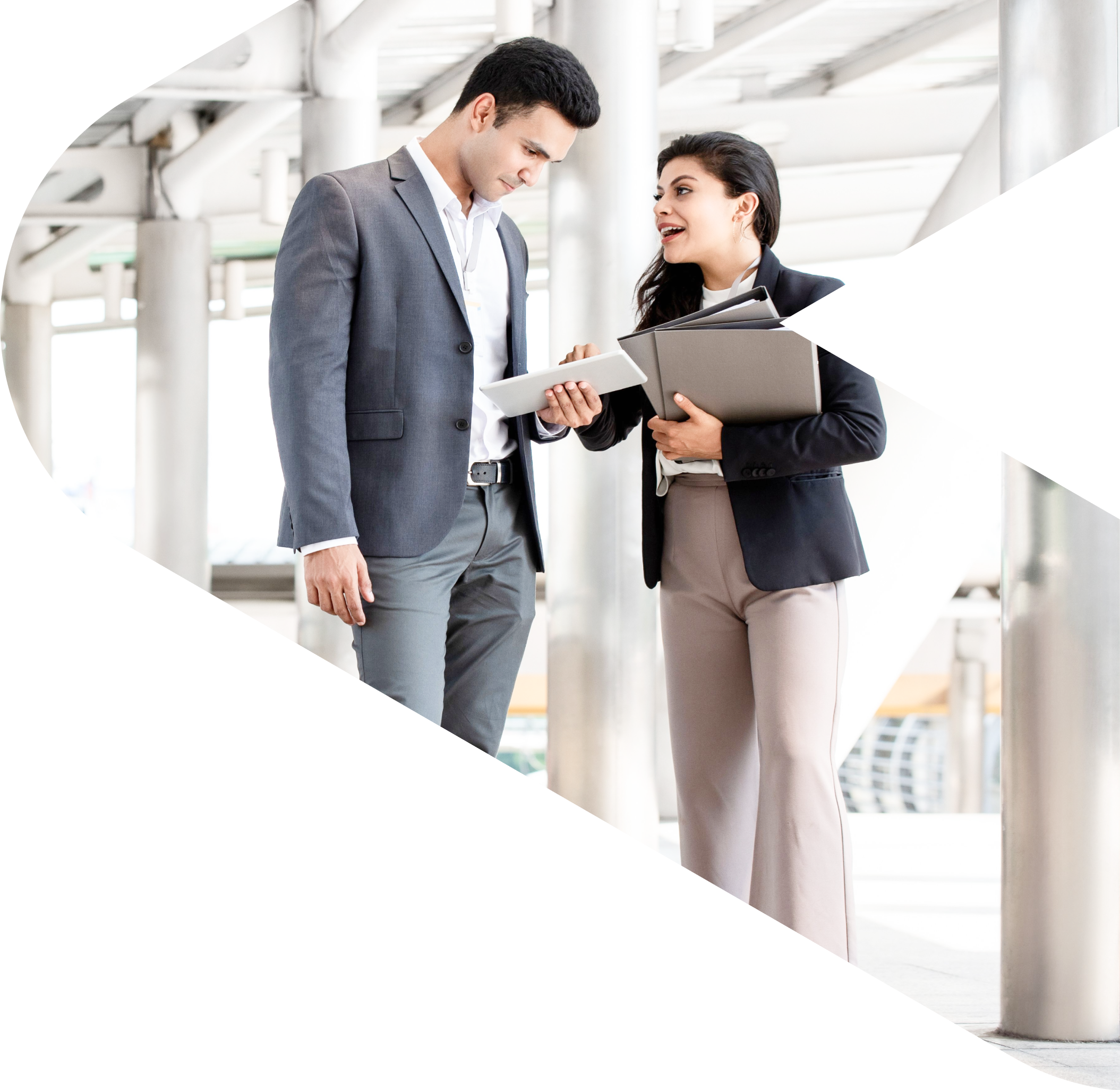 Two people standing and speaking