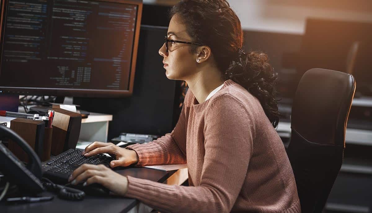Person typing at computer