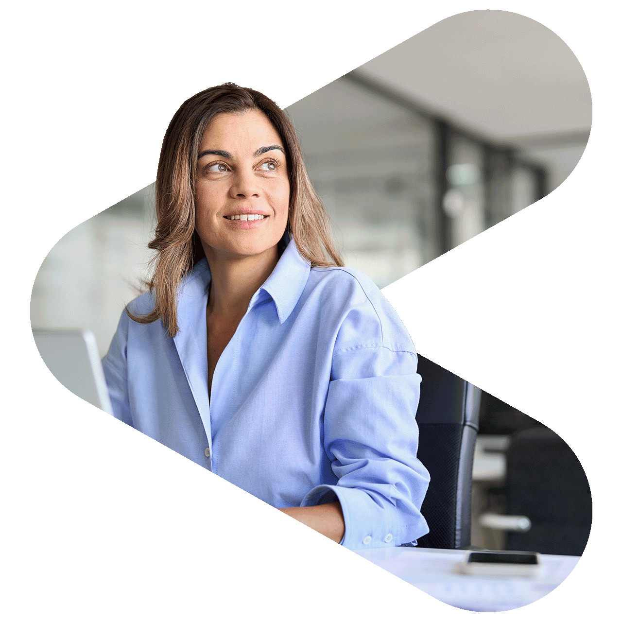 woman sitting at desk in an office looking out to her left