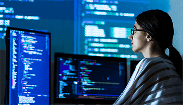 Data engineer sitting in front of a computer