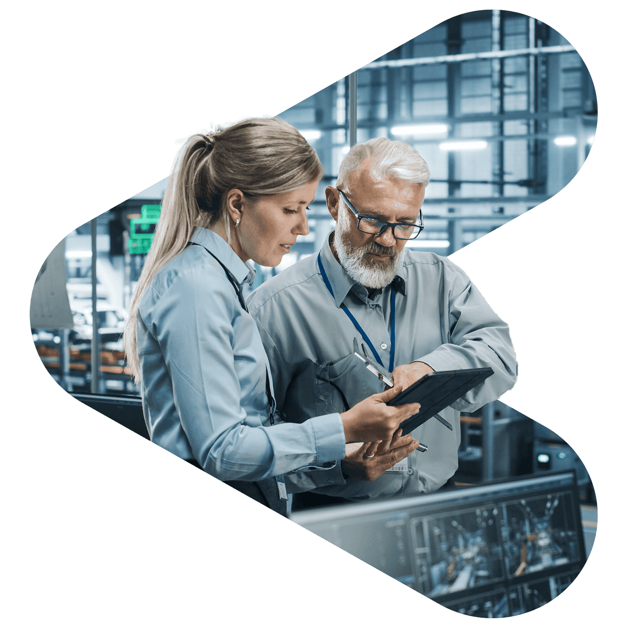 two workers in warehouse using tablet