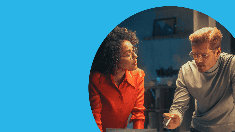 Hands typing on a laptop computer