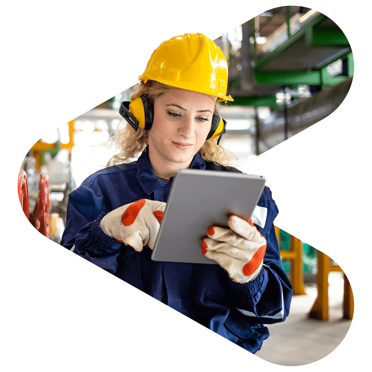 warehouse worker wearing hard hat and using tablet