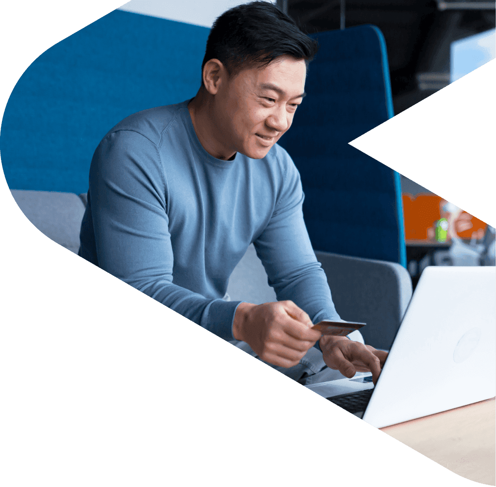 Woman handing a man money in a shop