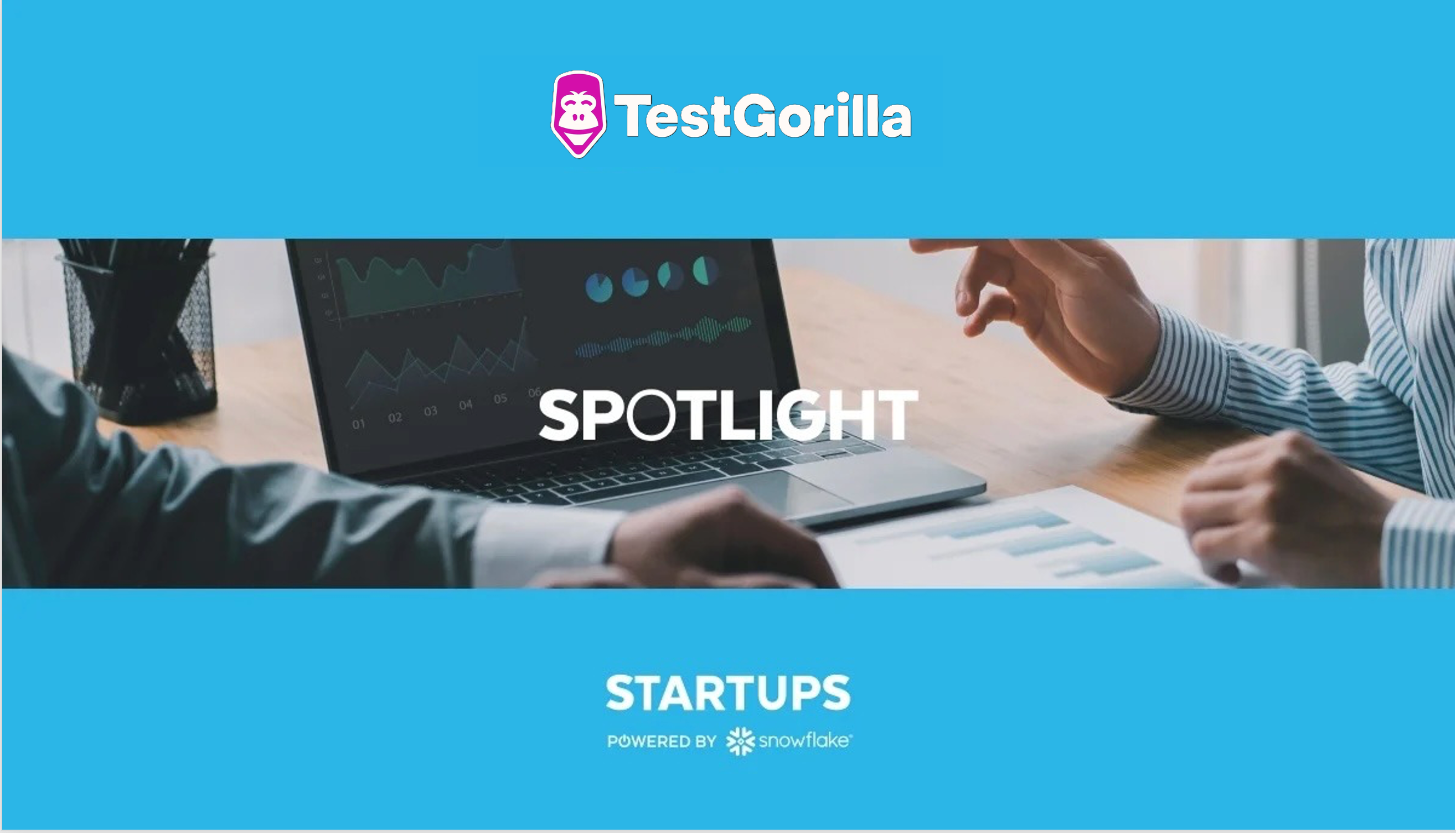 TestGorilla and Snowflake Startups logos on blue background with photo of people using a laptop computer