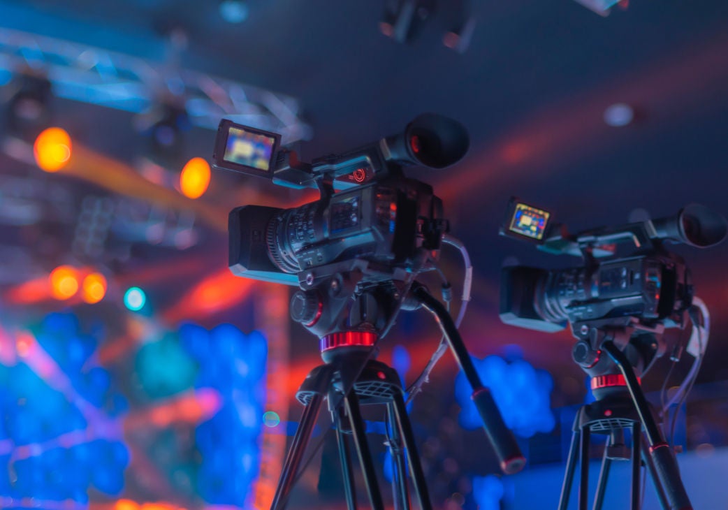 silhouette of a cameraman operator operating a camera